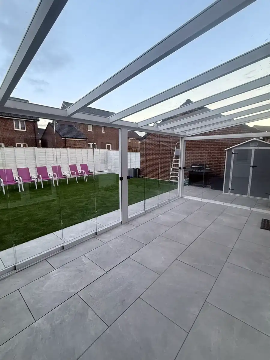 View from inside the white glass room towards the garden