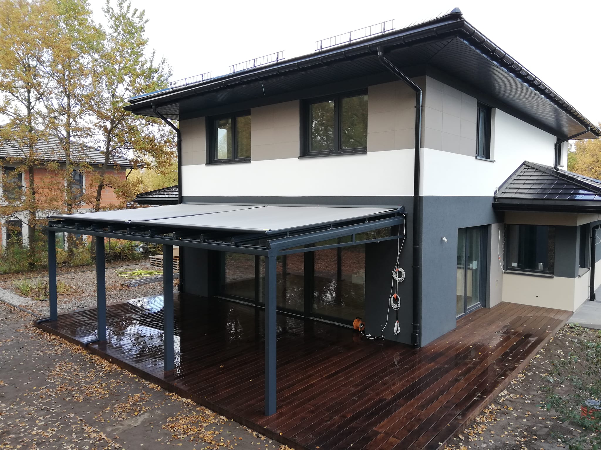 electric awnings on glass veranda